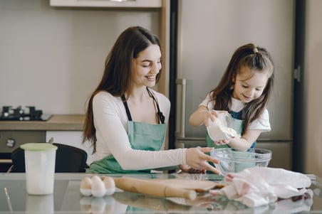 photo-of-girl-pouring-flour-on-bowl-4149028