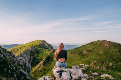 woman-wearing-black-shirt-sitting-on-rock-2819549 (1)